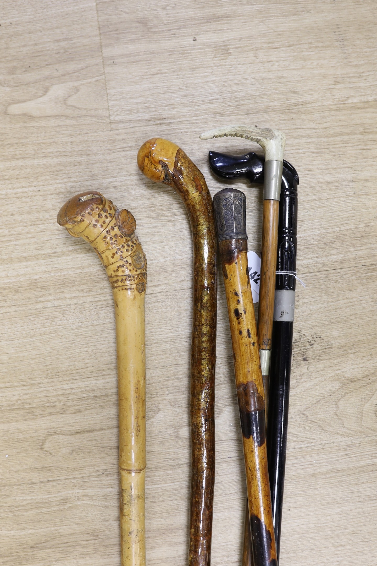 A small bundle of three walking canes